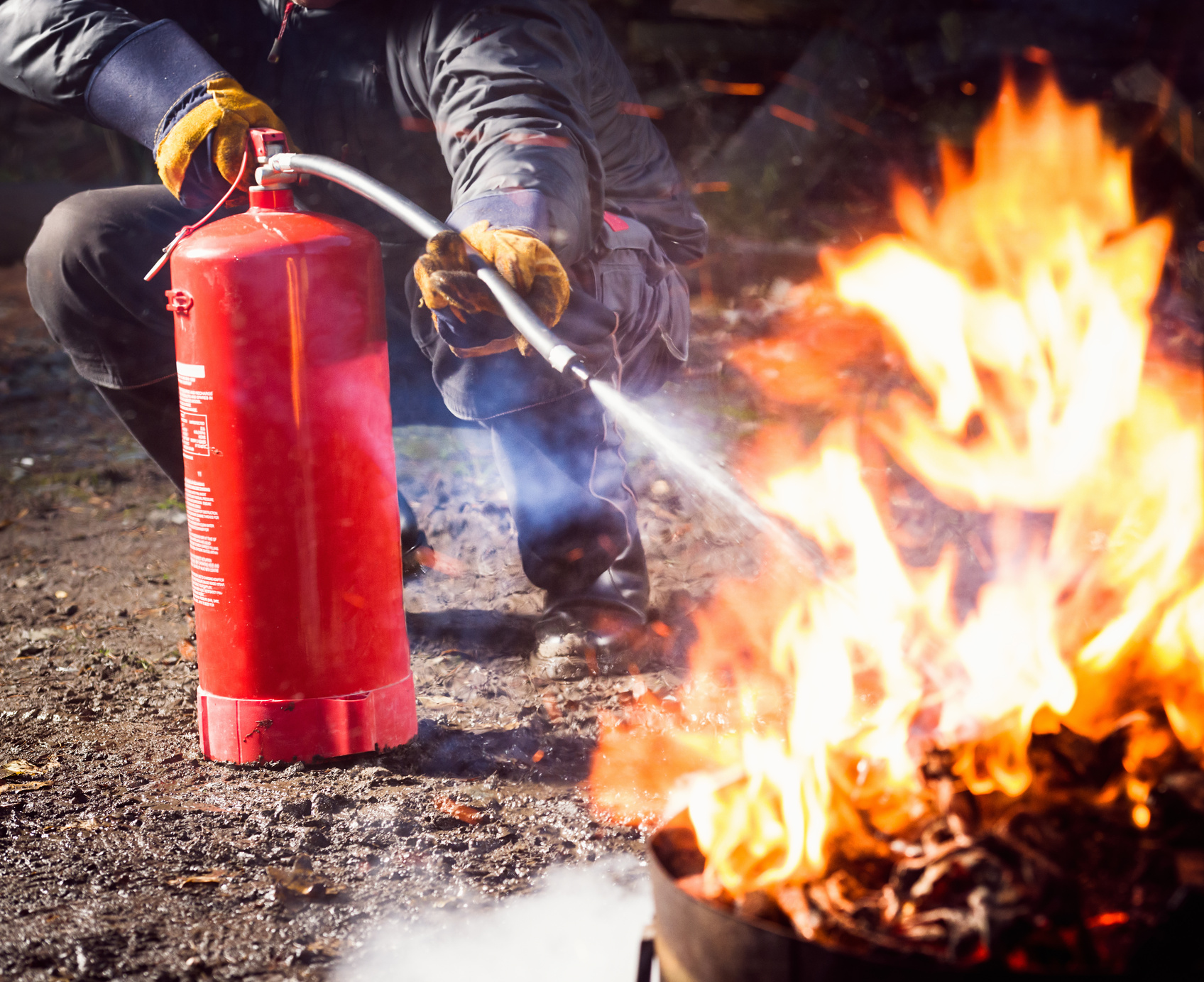 Using a fire extinguisher to fight fire